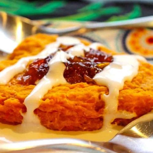 Sweet patoto cake Mbatata is topped with mango jam and coconut sauce
