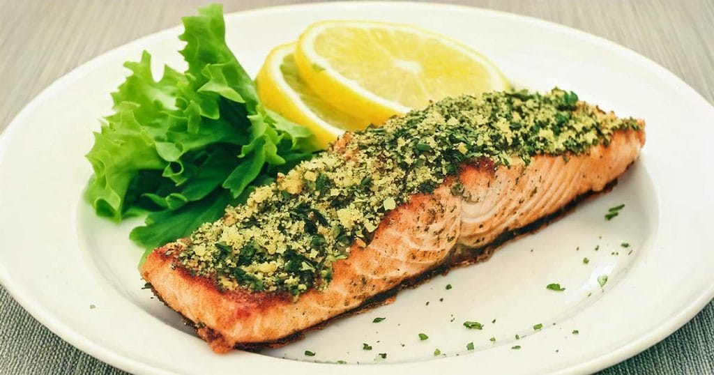 A fillet of salmon with crusted herbs topping