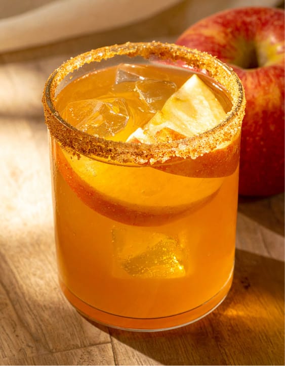 Simple apple cider margarita with cinnamon sugar rim