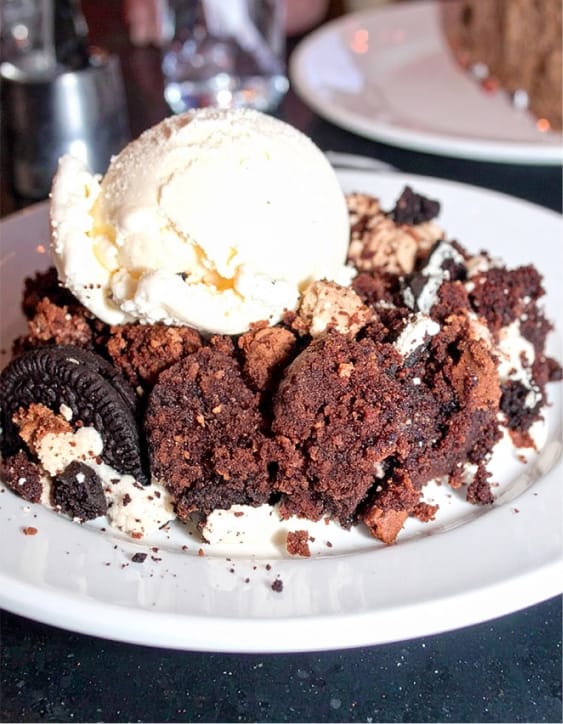 Easy Oreo dump cake topped with vanilla ice cream