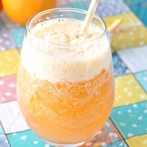 Orange sherbet punch with sherbet on top