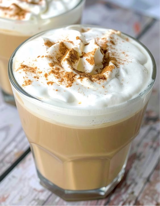 Simple apple cider latte with whipped cream