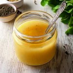 apple cider salad dressing on the wood table