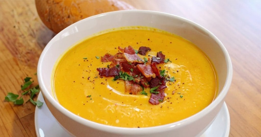 A bowl of butternut squash bacon soup
