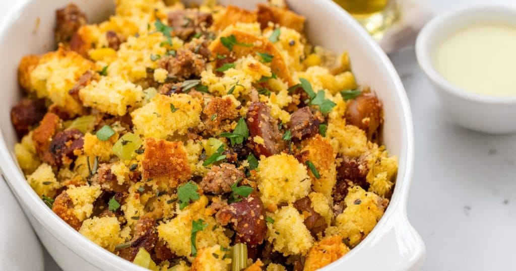 Cornbread stuffing is mixed with crumbled sausage