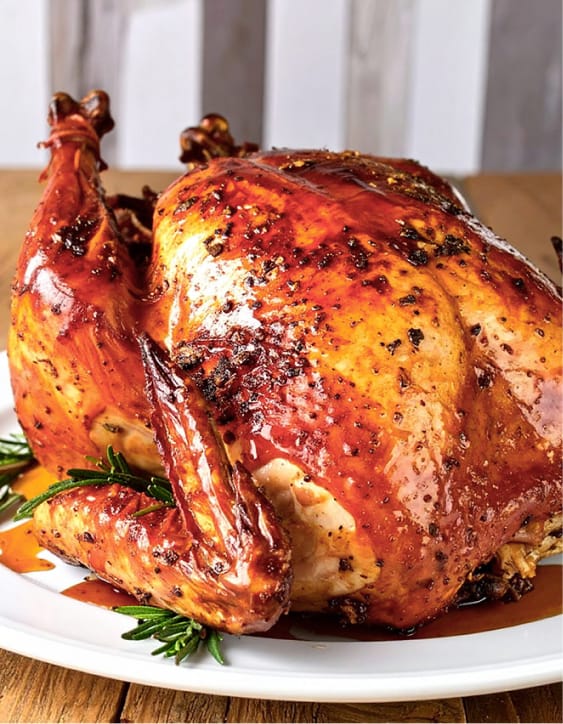 Thanksgiving turkey is glazed with honey chipotle sauce