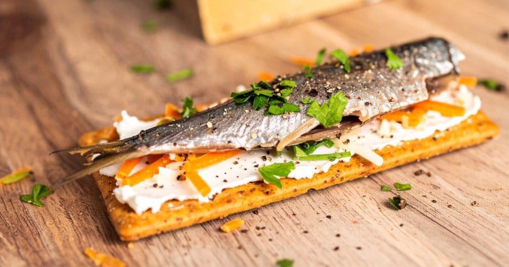 Sardine Cracker Cheese with grated cheddar cheese, canned sardine, sprinkled with chopped parsley