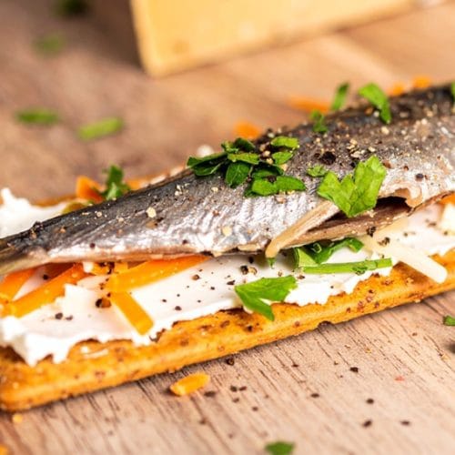 Sardine Cracker Cheese with grated cheddar cheese, canned sardine, sprinkled with chopped parsley