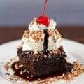 A slice of chocolate brownie with sundae ice cream