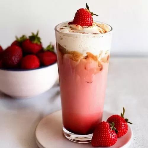 Strawberry latte with frothed milk