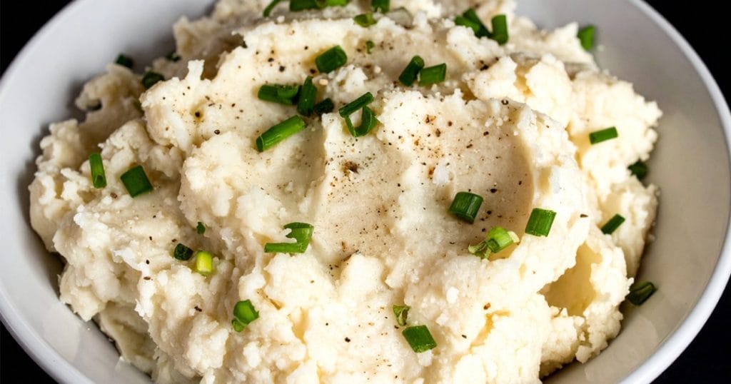 Parmesan Mashed Cauliflower topped with chopped green onions