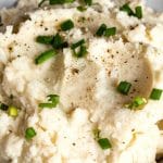 Parmesan Mashed Cauliflower topped with chopped green onions