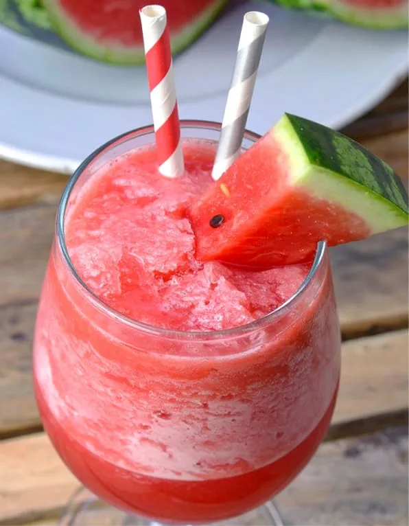 Watermelon daiquiri is garnished with a small slice of watermelon