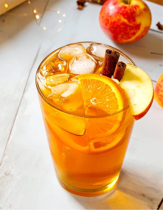 Apple cider punch with ginger ale, fruit juice, and spices