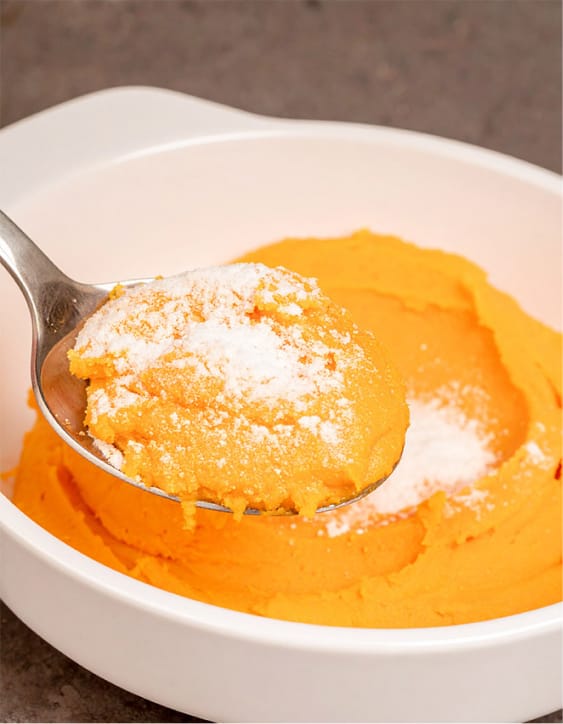Carrot souffle is dusted with powdered sugar