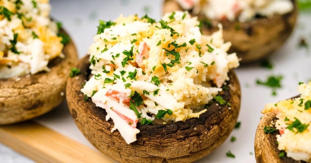 Mushrooms stuffed with crab meat, cream cheese, and mayo