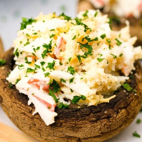 Mushrooms stuffed with crab meat, cream cheese, and mayo