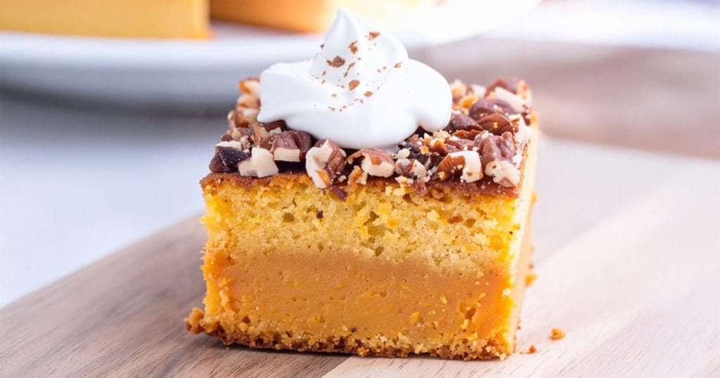 Pumpkin Dump Cake with whipped topping on top