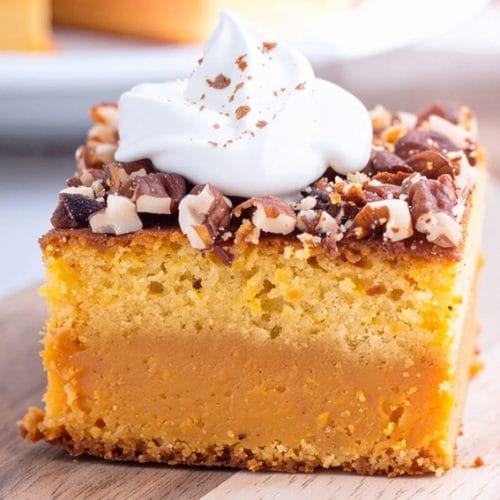 Pumpkin Dump Cake with whipped topping on top
