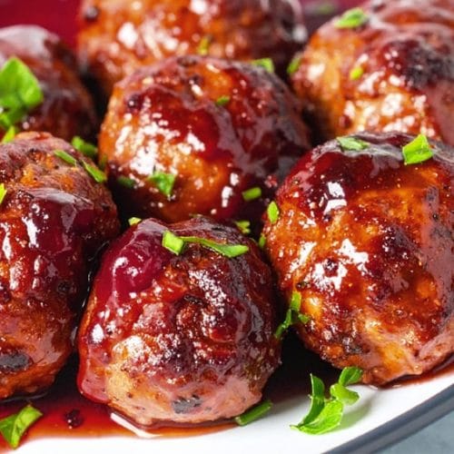Baked turkey meatballs are coated with cranberry glaze